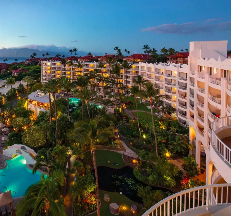 The premise of Fairmont Kea Lani Maui beaming with lights at evening time