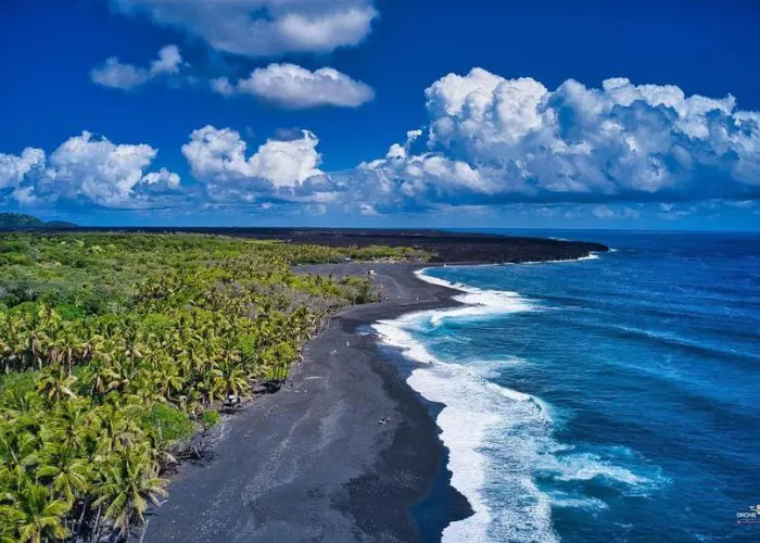 Enjoy the view of black sand and water activities at Isaac Hale Beach Park