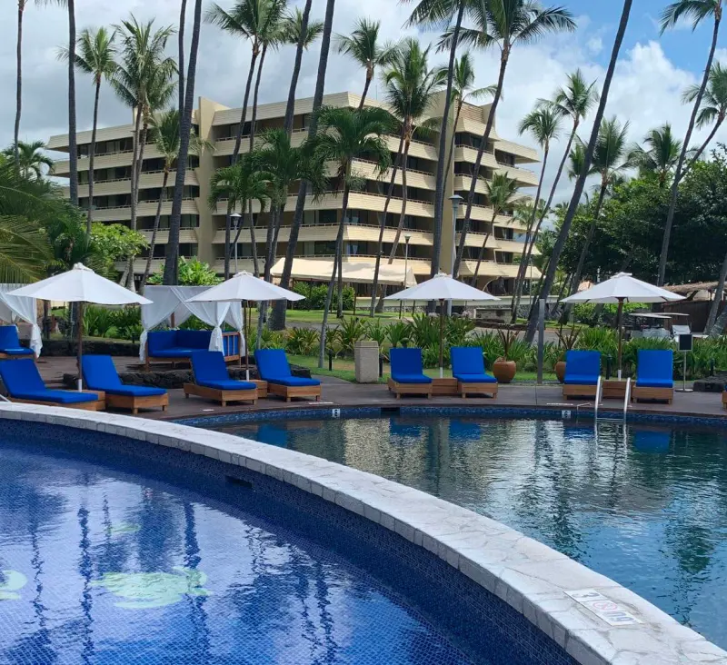 The outdoor pool and relaxing sun loungers at Royal Kona Resort