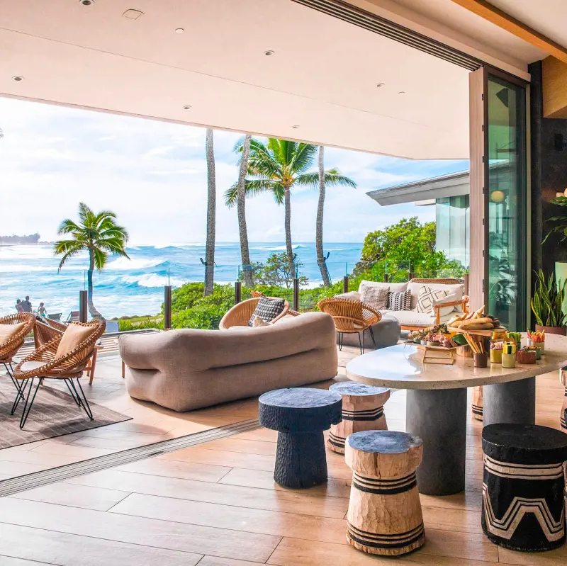 A terrace with living and dining area with a sweeping ocean view at Turtle Bay Resort