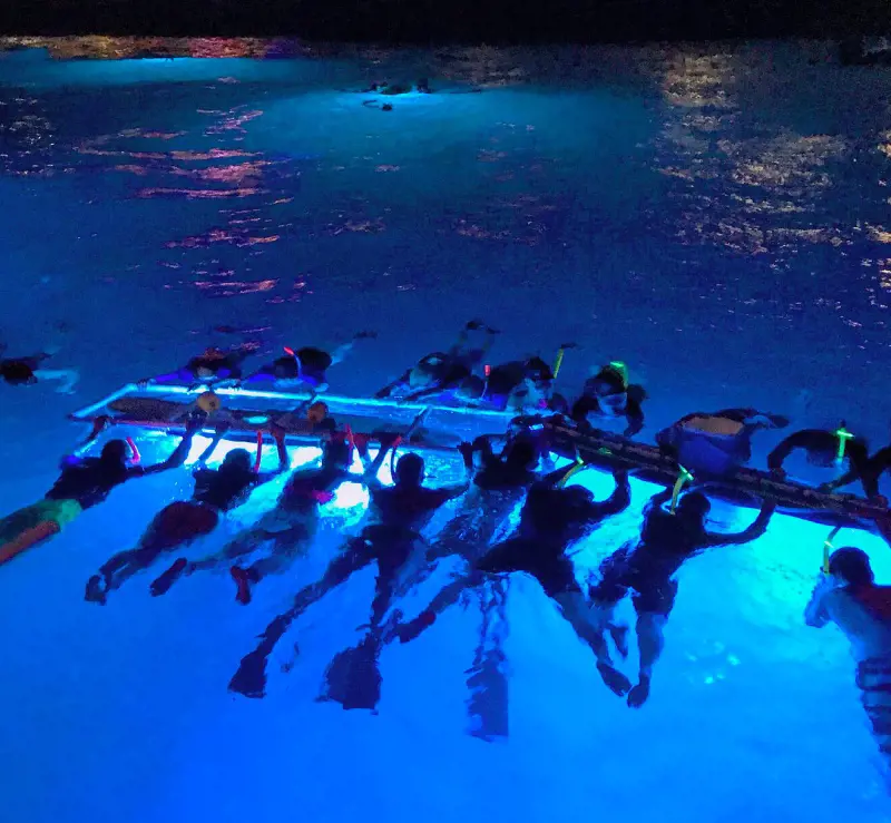 Divers using a customized lightboard to spot the Manta Rays on the Kona Coast