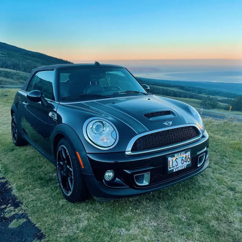 A luxurious Mini Cooper parked uphill in Haleakala National Park