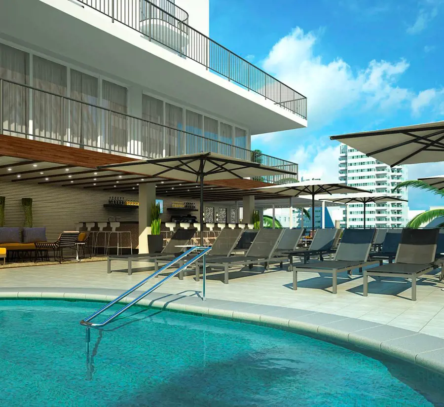 The sunloungers by the deck of the outdoor pool at Hilton Garden Inn Waikiki Beach