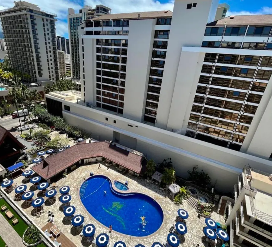 A bird's eye view of the Outrigger Reef Waikiki Beach Resort and its pool deck