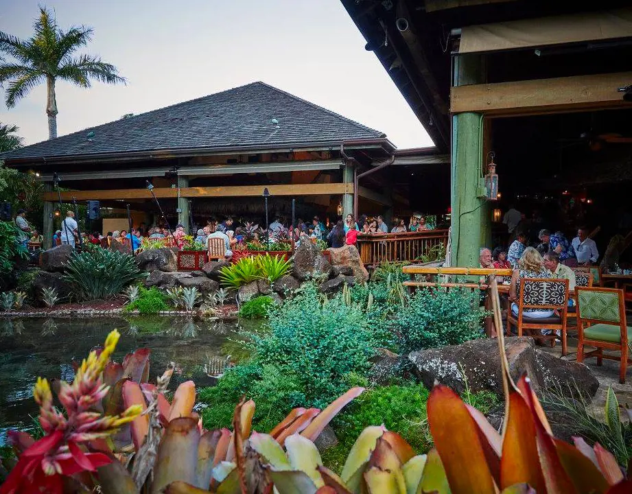 Keoki's Paradise restaurant in Kauai with lush foliage creates a relaxed environment to enjoy the decadent culinary creations