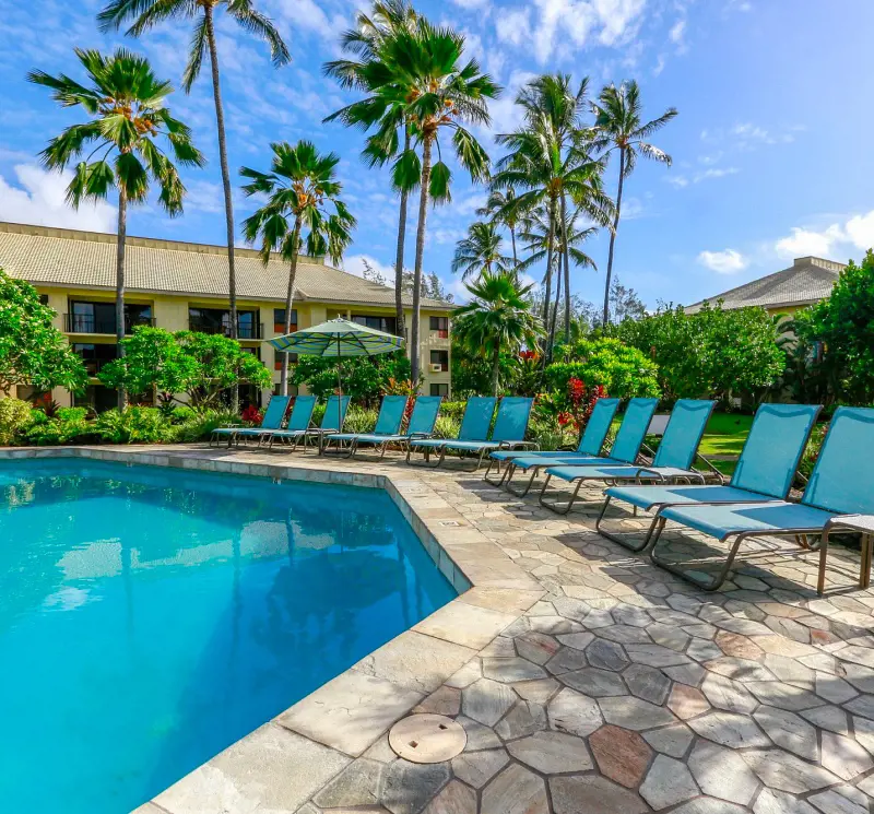 The sunloungers lined up by the pool at Wyndham Kauai Beach Villa