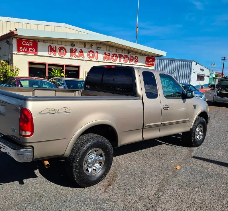A vehicle from Maui Car Rentals parked at No Ka Oi Motors Dealership