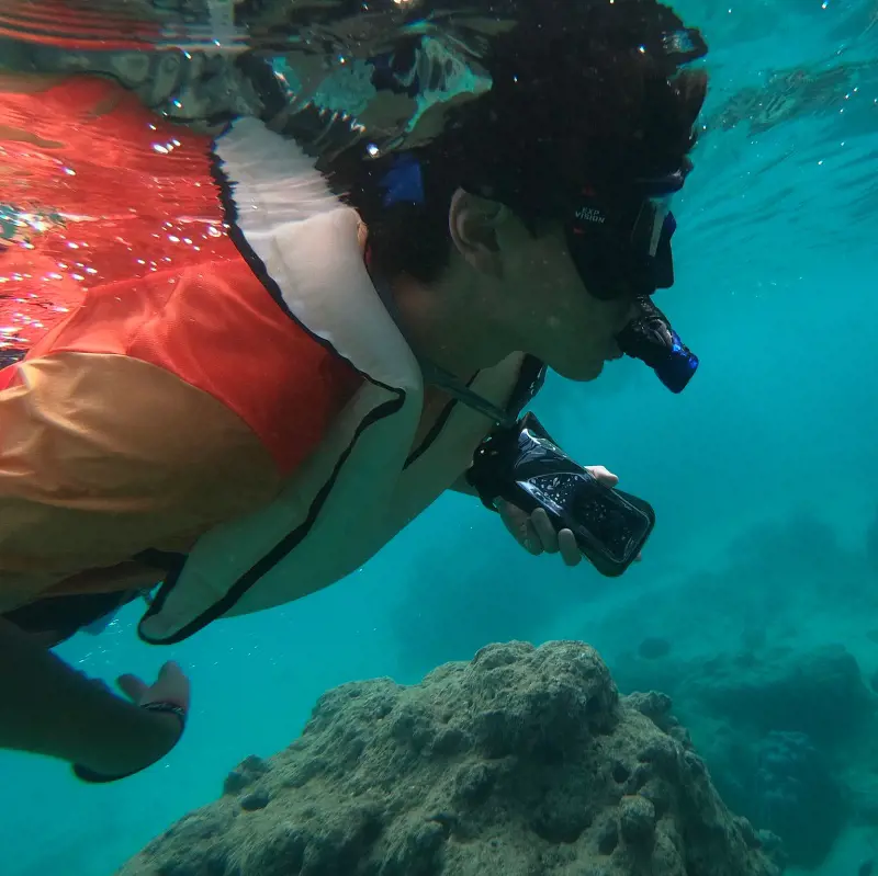A tourist captured in close up exploring the waters at Hanauma Bay
