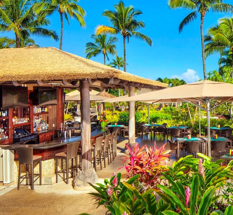 Wailele Bar and the open-air outdoor dining area at Nanea Restaurant and Bar