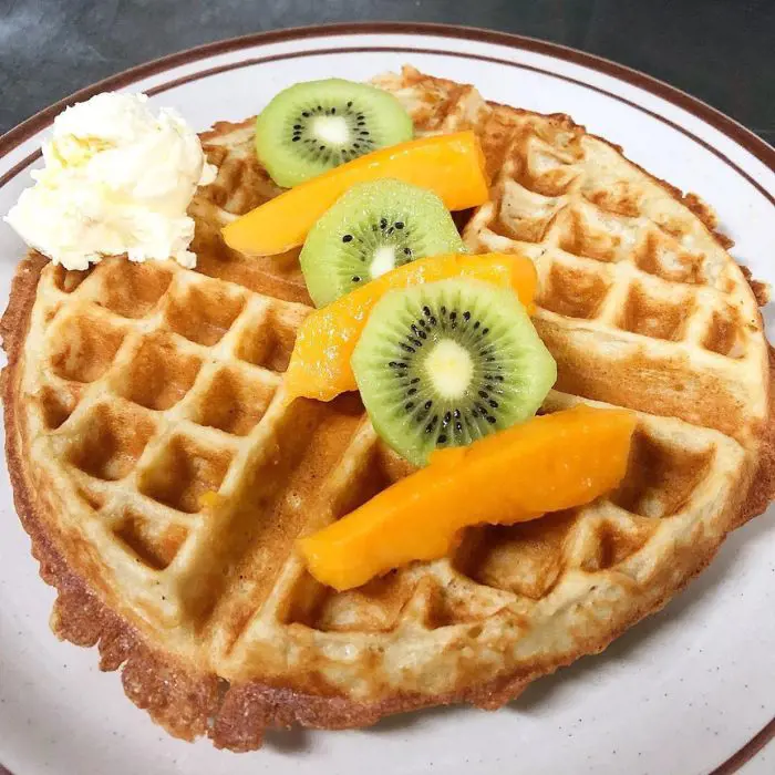 Belgian Waffle topped with fruits and cream