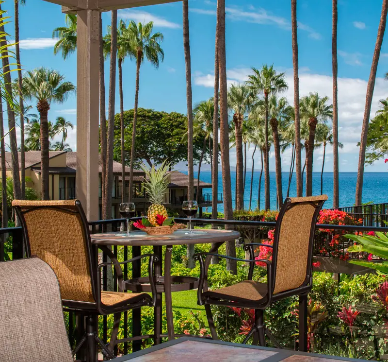 A balcony with a beautiful view of the lush garden at Wailea Elua Village