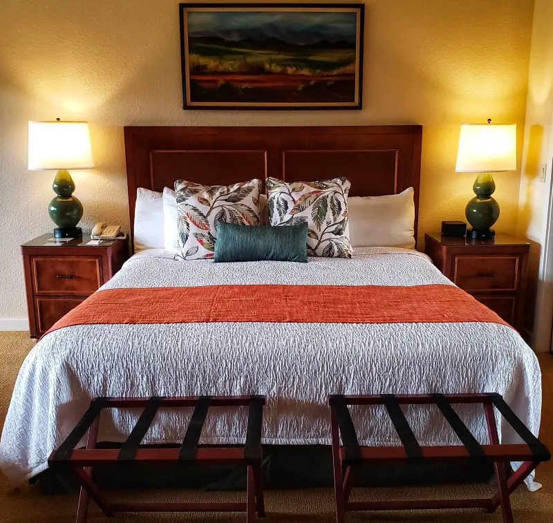 A cozy King-size bed with premium linens in Napili Kai Beach Resort