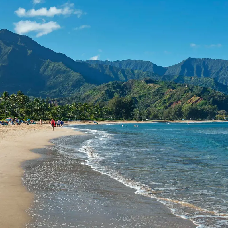A gorgeous view of the Hanalei Beach and the green mountains on the backdrop