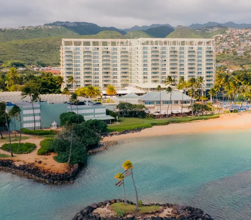 A breathtaking view of The Kahala Hotel & Resort, the pristine beach and lush gardens
