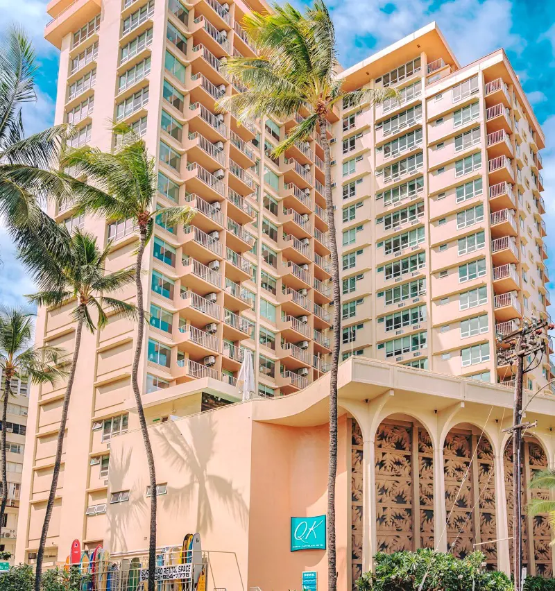 The tall-rising building of the Queen Kapiolani Hotel captured on bright day